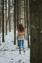 Girl in winter forest