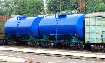 Fototapeta na wymiar Railway tanks. Copy space. Set of tanks with oil and fuel transport by rail. Gasoline tanker railroad 