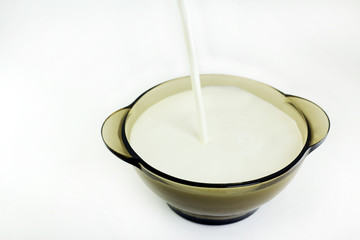 milk pours into the Cup