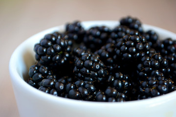 Blackberry in the cup. Summer berry. Close up