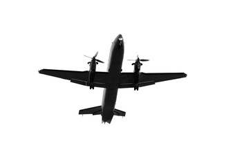 silhouette of a multi prop aircraft flying overhead, white background