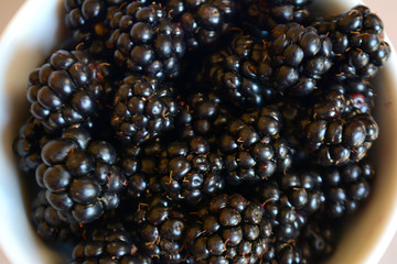 Blackberry in the cup. Summer berry. Top view