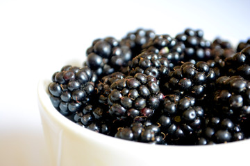 Blackberry in the cup. Summer berry. Top view