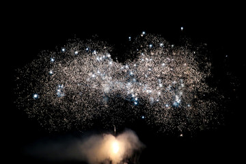 Fireworks display on dark sky background