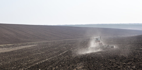Harrowing the soil with disc harrows