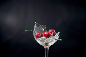 Broken glass in front of black background 