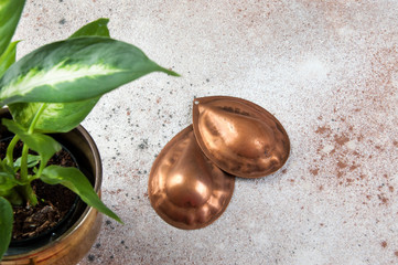 Vintage copper molds on a concrete background.