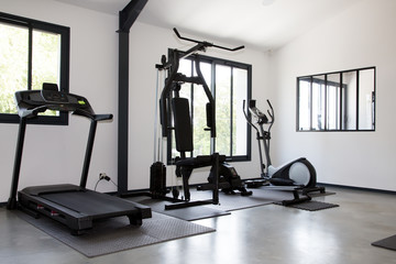 Fototapeta na wymiar gym modern fitness center room in the sport club