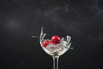 Broken glass in front of black background photographed under the name glass shards cocktail
