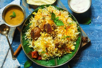 Homemade Chicken Biryani on banana leaf overhead view