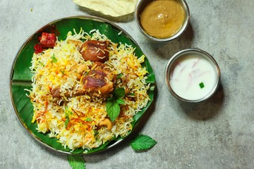 Homemade Chicken Biryani on banana leaf overhead view