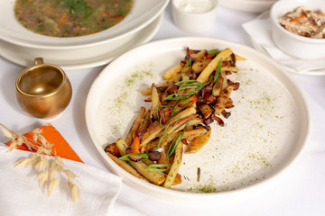 Fried potatoes with mushrooms