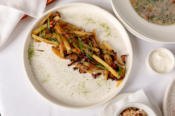 Fried potatoes with mushrooms, top view