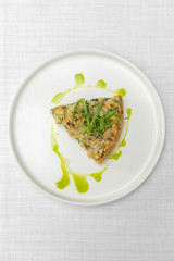 quiche an open pie with salmon. top view