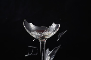 Broken glass in front of black background photographed under the name glass shards cocktail
