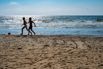 Playing on the beach. Miseno beach, Naples (Italy)