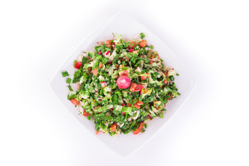 Fresh vegetable Arabic salad (Arabic, Syria), isolated on white background. Healthy food.