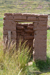 Ancient abandoned toilet made of adobe.