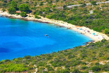 Sandy beach and blue sea near Primosten touristic destination in Croatia
