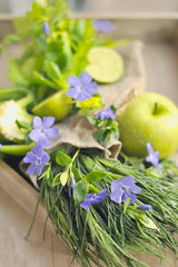 green apples and lime, green onions. Autumn Bouquet of fruits and flowers