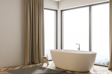 Fototapeta na wymiar White bathtub in beige curtains bathroom side view