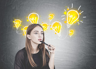 Pensive young woman with pen, idea