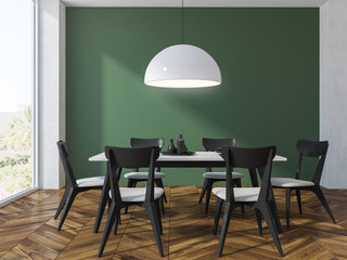 Green wall dining room interior