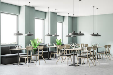 Cozy small cafe corner with green walls