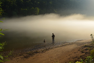 Man and Dog Fishing