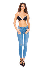 Young beautiful brunette woman in blue jeans