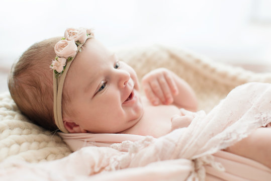 Smiling newborn baby. Photoshoot for the newborn. 7 days from birth. A  portrait of a beautiful, seven day old, newborn baby girl Stock Photo |  Adobe Stock