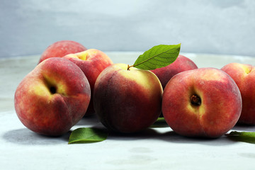 A group of ripe peaches on table