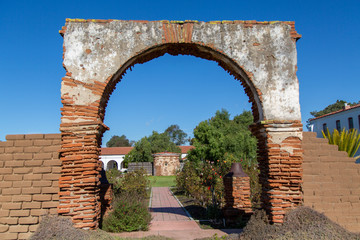 An Adobe Plaster and Brick Arch at the Entrance to San Luis Rey Mission, California