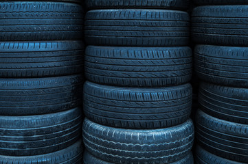 Obraz premium Stack of used tires. Dirty tires. Pile of tires. Black tire.