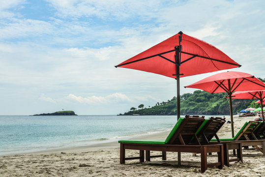 Beach lounge chairs with umbrella on the White Sand beach