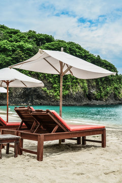 Beach lounge chairs with umbrella