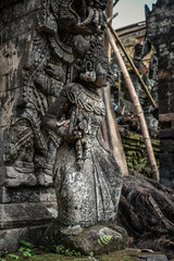 Fototapeta na wymiar Sculpture of woman in Pura Dalem Segara Madhu