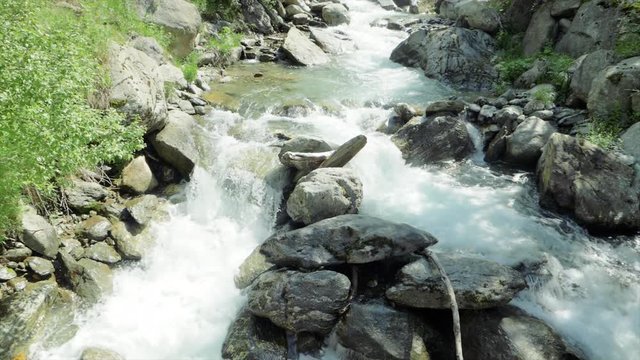 SLOW MOTION Watching a waterfall on a hike in Auron, France.