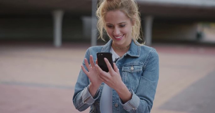 portrait stylish young woman using smartphone enjoying carefree lifestyle digital communication on mobile device slow motion