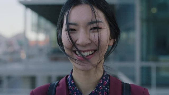 beautiful laughing asian woman portrait of young corporate student happy 