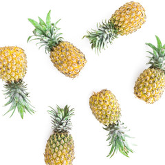 Tropical food concept with pineapple fruits on white background. Flat lay, top view.
