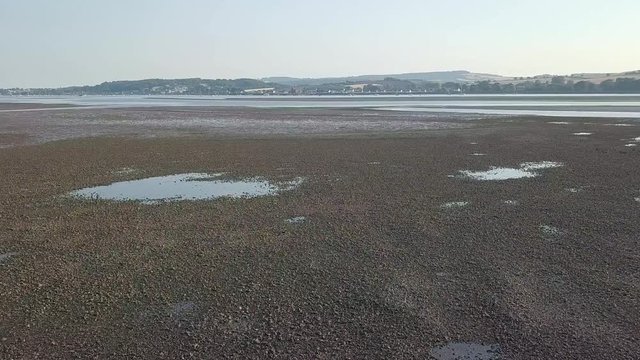DRONE VIDEO flying over river estuary at Lympstone in Devon.