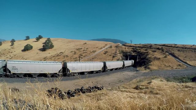 CALIENTE, CALIFORNIA &ndash; JULY 14, 2018: A freight train goes through a tunnel on the Tehachapi Pass line