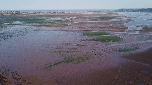 AERIAL FOOTAGE ascending over the sandy estuary at Lympstone in Devon