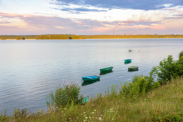 Boats on a lake at sunset