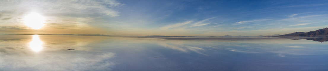 Aerial Uyuni reflections are one of the most amazing things that a photographer can see. Here we can see how the sunrise over an infinite horizon with the Uyuni salt flats making a wonderful mirror. 