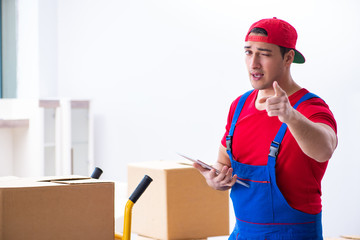 Contractor worker moving boxes during office move
