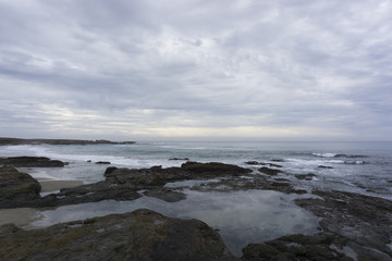 Fototapeta na wymiar Overcast Pacific Coast Beach