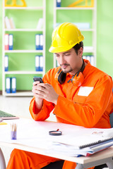 Construction supervisor planning new project in office