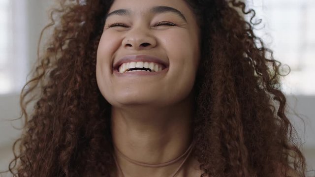 cute young woman close up portrait of happy mixed race girl laughing cheerful enjoying successful lifestyle